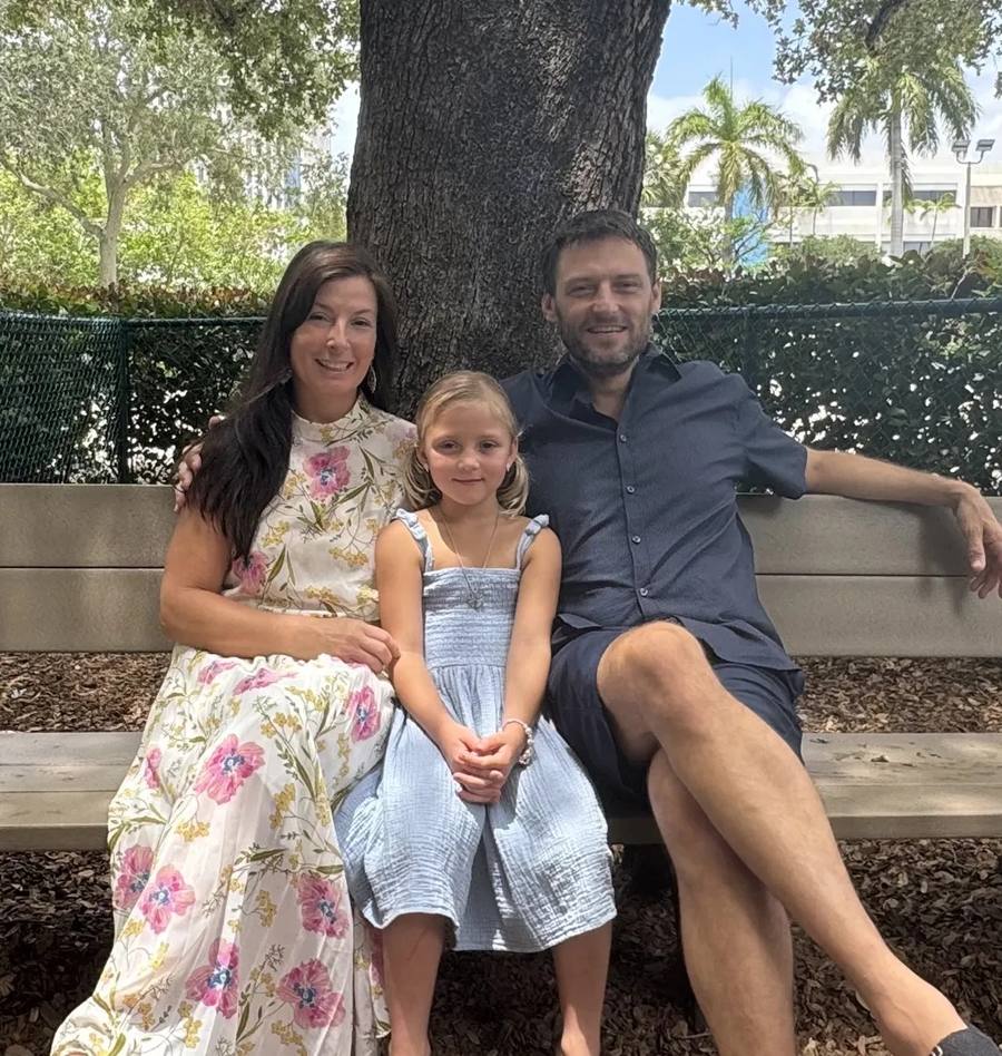 Jim, Olga and Olivia Blackburn on a park bench
